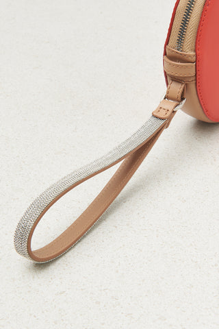 Round genuine leather bag with wristband and shoulder strap