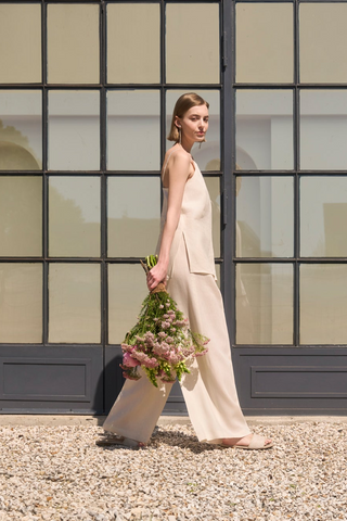 Woman with Auea linen top and trousers