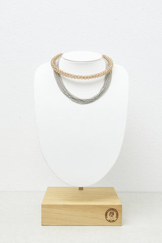 Rigid tubular necklace with micro-crystals