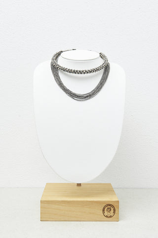 Rigid tubular necklace with micro-crystals